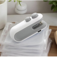 Портативний ручний запаювач пакетів білий 10×4×3,5 см  компактний зварювач для герметичного пакування продуктів