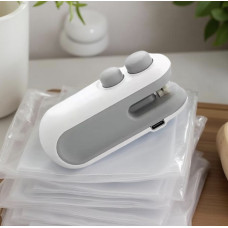 Портативний ручний запаювач пакетів білий 10×4×3,5 см  компактний зварювач для герметичного пакування продуктів